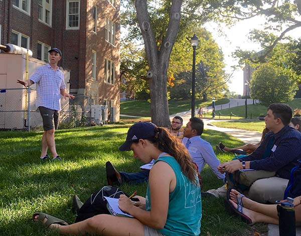 students sitting outside